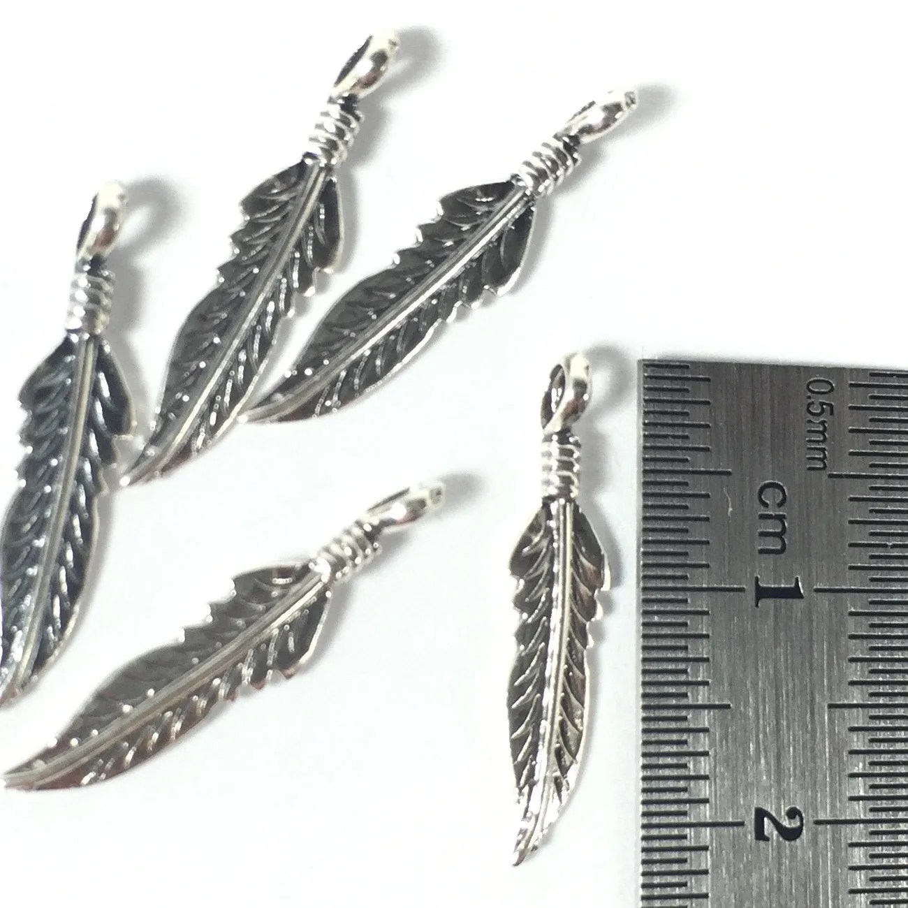 Sterling tribal feather 22mm, right and left, 10 pack, with loop, naive style, southwest chic