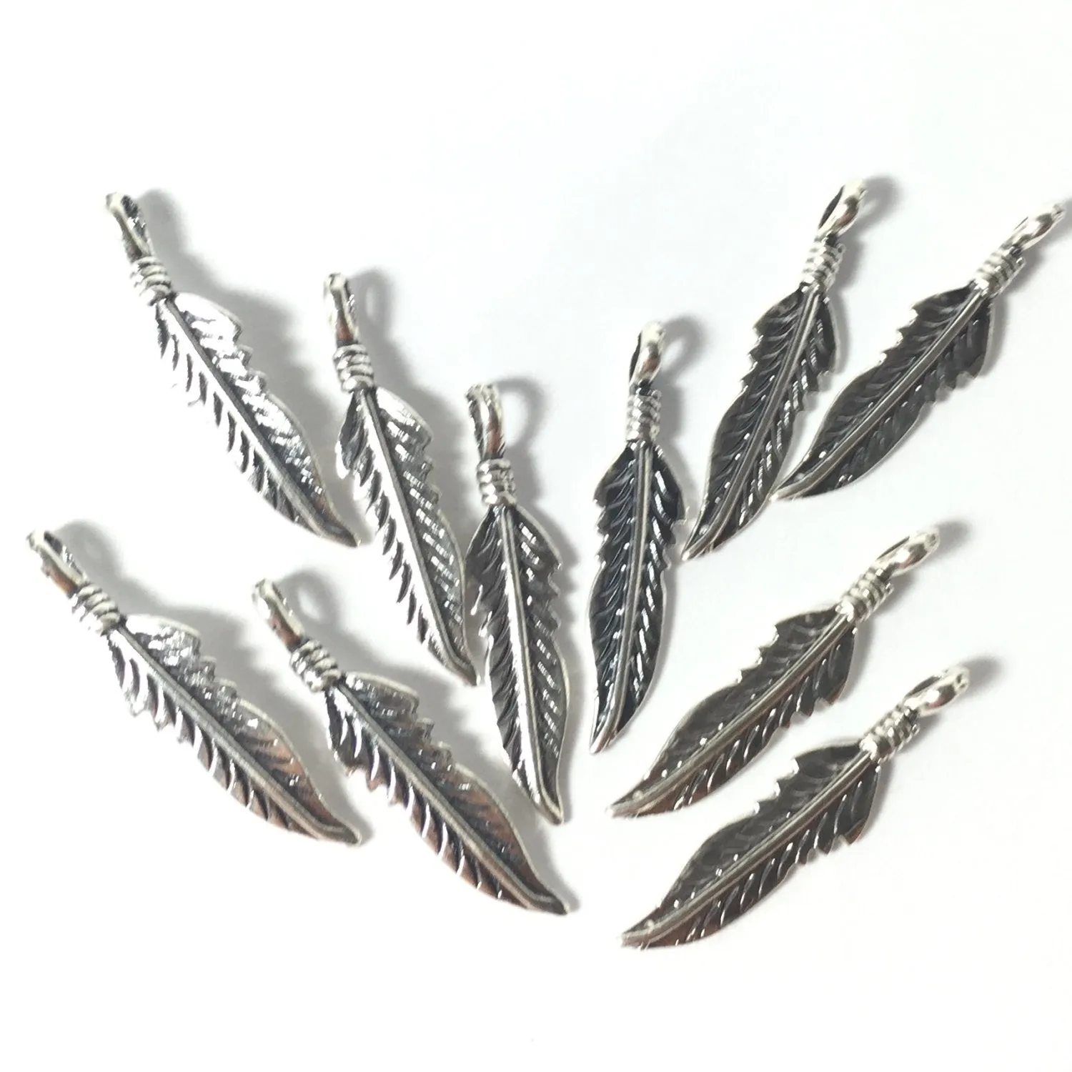 Sterling tribal feather 22mm, right and left, 10 pack, with loop, naive style, southwest chic